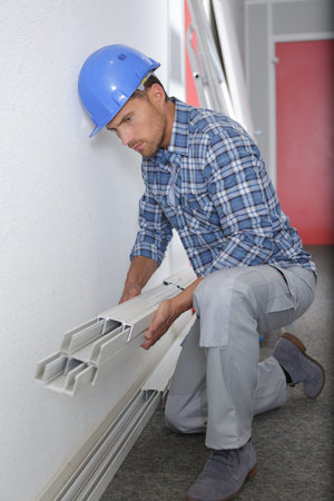 worker installing lifting system