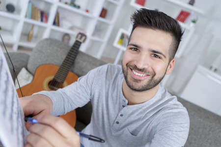 writing a song for guitar playingの写真素材
