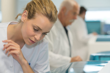 portrathinking female doctor at a lab