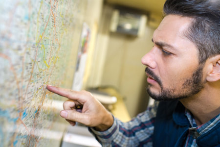 worker looking at a map