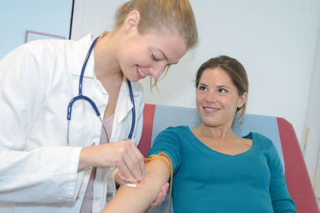 nurse taking a blood sampleの写真素材