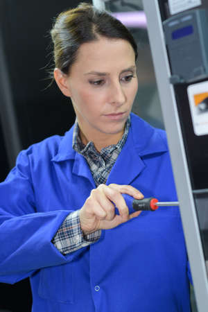 young engineer working in network server roomの写真素材