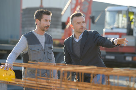 men having a conversation on the construction site