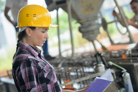 confident female engineer in shipping yard