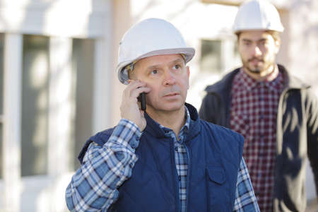 architect having a call on the cellular phoneの写真素材