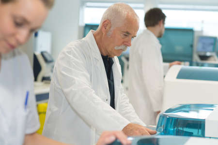 life scientist researching in laboratoryの写真素材