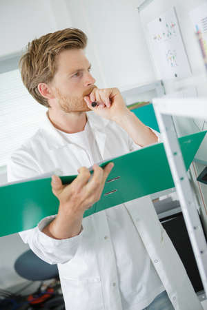 male student thinking during maths courseの写真素材