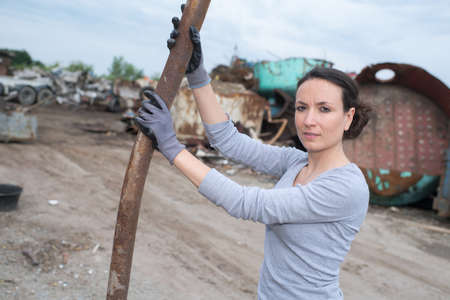 female working at scrap metal yardの写真素材