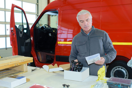 man reading the warranty paper