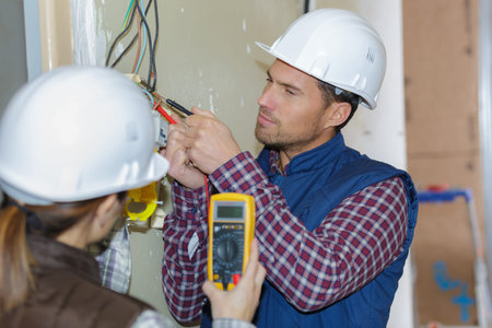 female trainee with mentor working at construction site