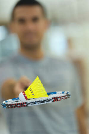 badminton shutter cock on a racketの写真素材