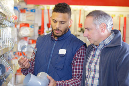 vendor in the hardware shop with clientの写真素材