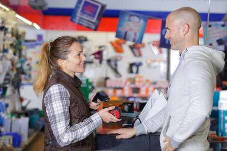 vendor and client at the counterの写真素材