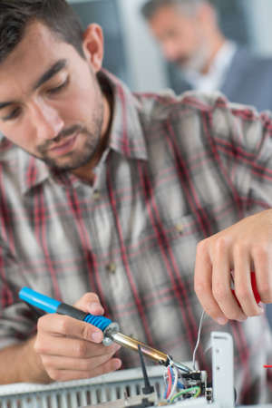 welding the cable on drone at homeの写真素材