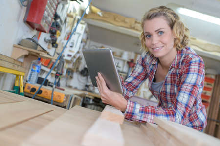 supervisor holding digital tablet in workshopの写真素材