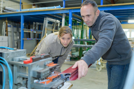 showing a new recruit the ropes in a steel factory