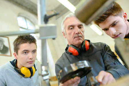 group of students in woodwork training course