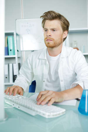 Young man using computerの写真素材