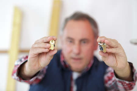 man holding a padlockの写真素材