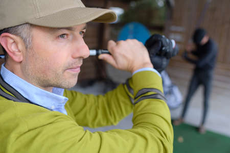 golfer man trying golf clubの写真素材