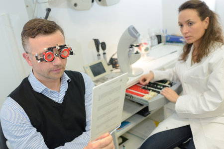 ophthalmologist and patient on eye test machine