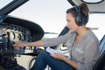 close up portrait of young woman helicopter pilotの写真素材