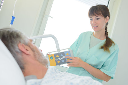 nurse explain patient how emergency buttons work