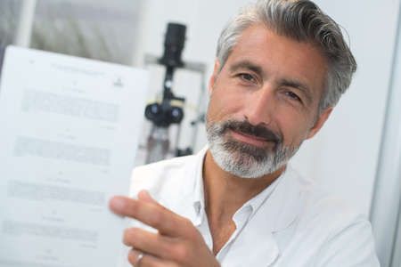 doctor showing a paper eye testの写真素材