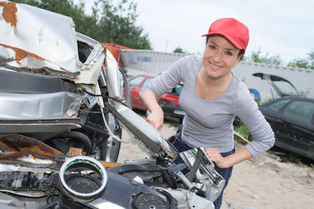 beautiful woman working in a scrap yardの写真素材