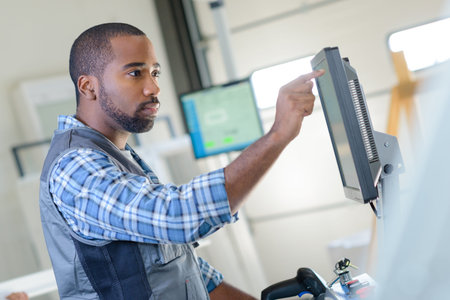 factory worker using computerの写真素材