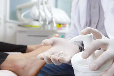 close up of medical staff washing handsの写真素材