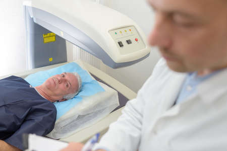 Man under scanning machineの写真素材