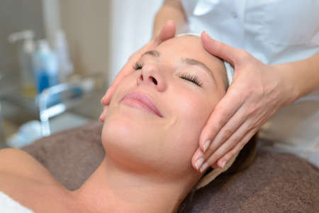 Woman having facial massageの写真素材
