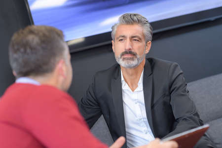 Two men in discussionの写真素材