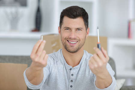 man holding a screwdriverの写真素材