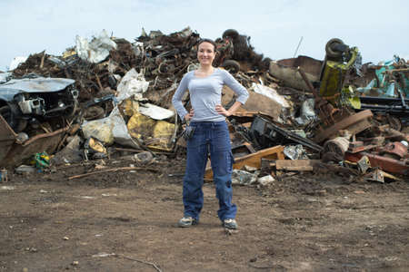 female worker posing at a scrap yardの写真素材