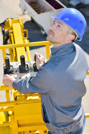worker driving a craneの写真素材