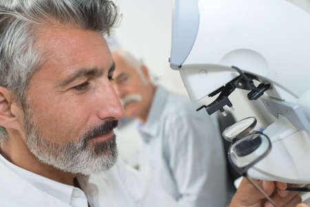 octor at work machine for checking visionの写真素材