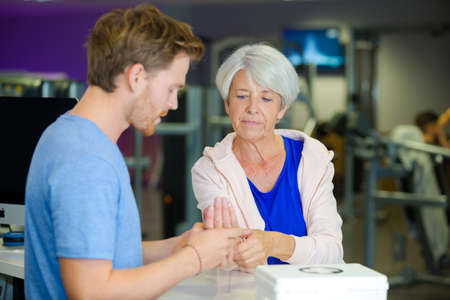 senior lady injured in the gymの写真素材