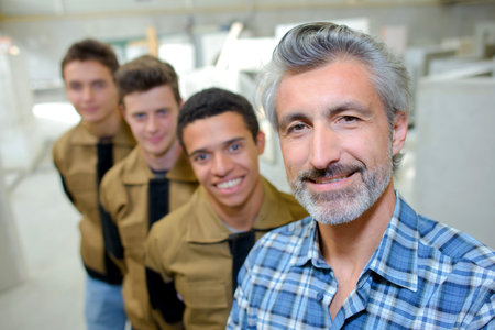 professor posing with vocational students