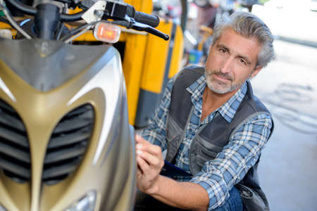 small engine mechanic posingの写真素材