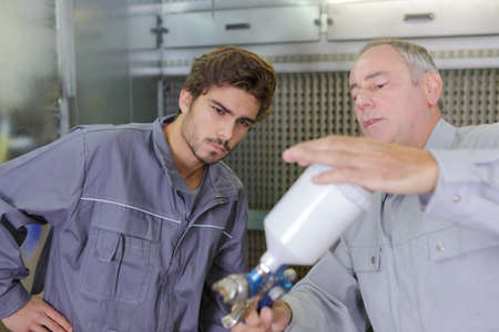 shaking the painting containerの写真素材