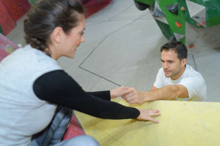 couple doing climbing exercisesの写真素材