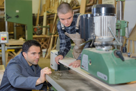 Men working in industrial workshop