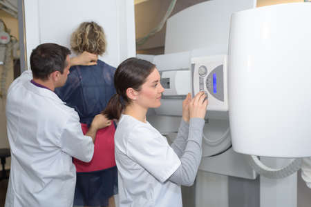 Nurse setting up xray machineの写真素材