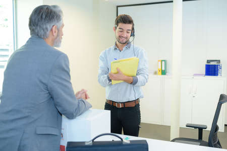 Male worker wearing headset with microphoneの写真素材