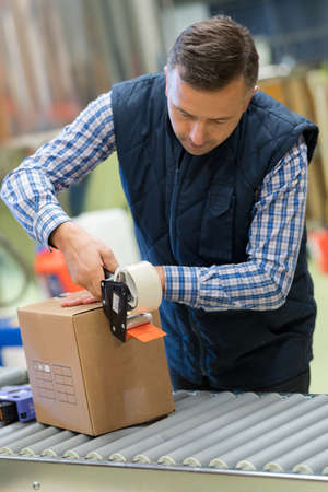 warehouse worker using scanner in the warehouseの写真素材