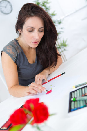 female drawing creative business sketch in notepad