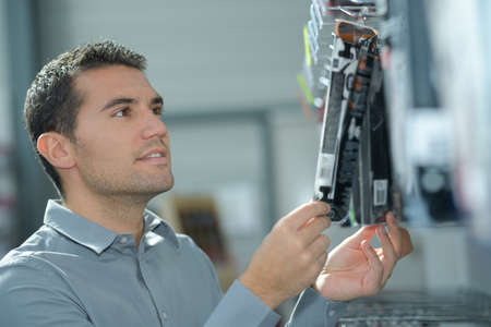 man with tool in storeの写真素材