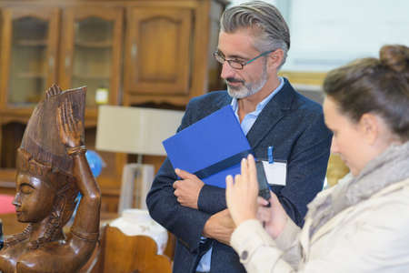 galmorous couple buying antiquesの写真素材